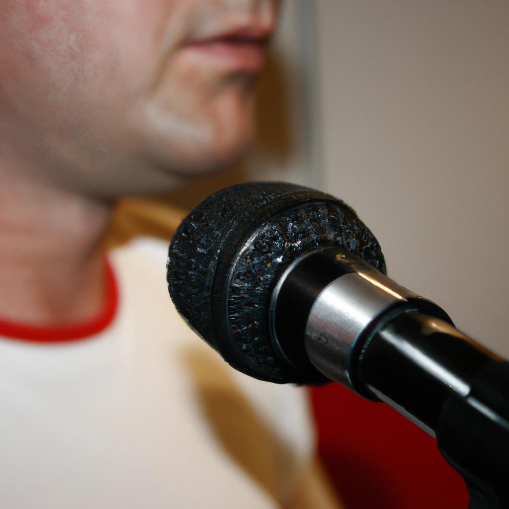 Person speaking into microphone, listening